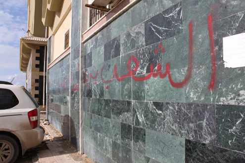 Escrito en árabe en un muro«La gente quiere derribar el régimen» 