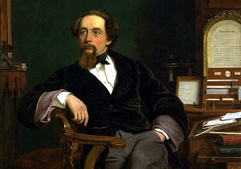 Charles Dickens sentado en un sillón