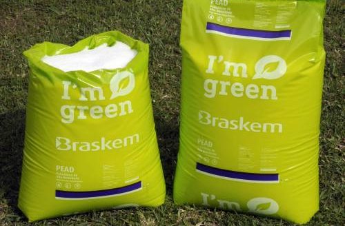 Dos sacos de color verde de polímeros que dicen en inglés 