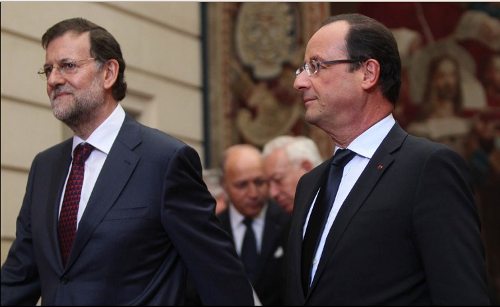 Rajoy y Hollande entrando en el Eíseo
